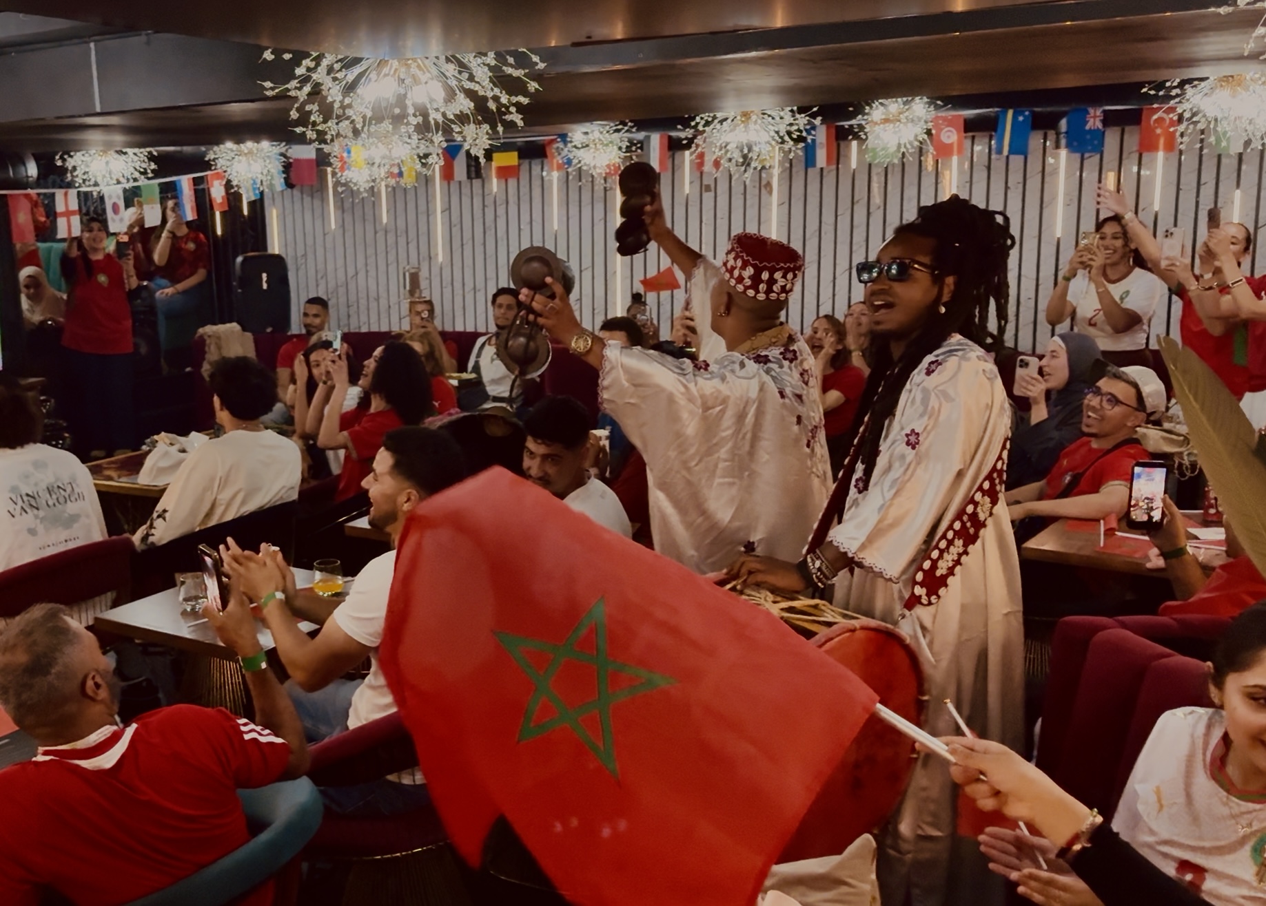 A packed room of guests celebrating at a Moroccan Collective event